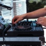 person playing black and white dj turntable