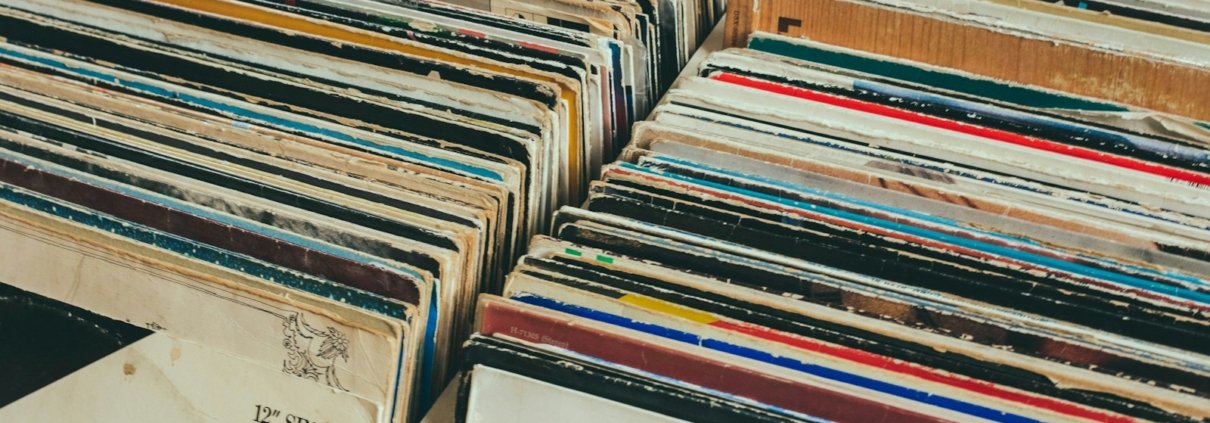 pile of assorted-title record sleeve on rack