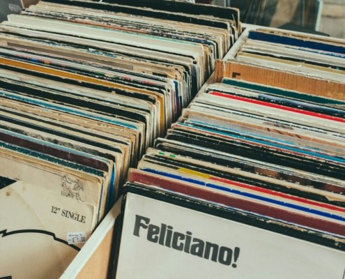 pile of assorted-title record sleeve on rack